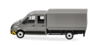 HER098328 - Camion MAN TGE gris à double cabine et parechoc à rayures jaunes - Herpa